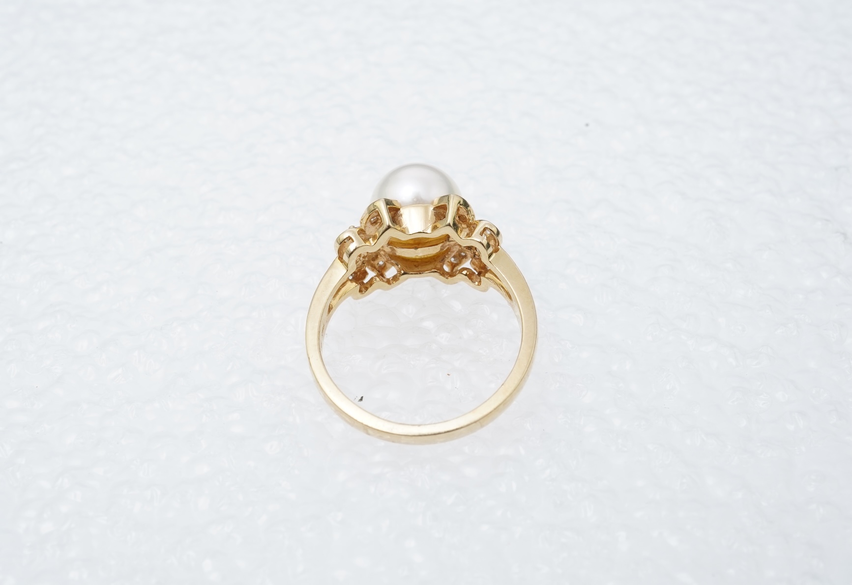 A cultured pearl and diamond ring